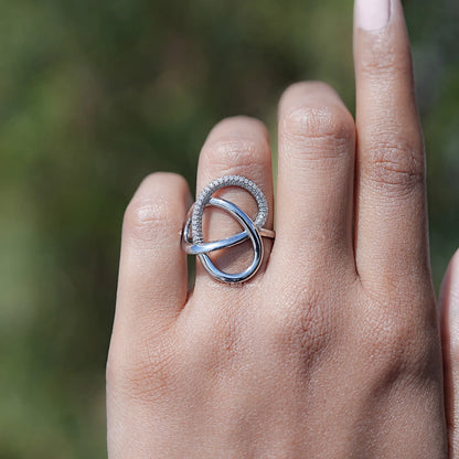 Sterling silver crisscross loop ring with round lab diamond halo and open center loop
