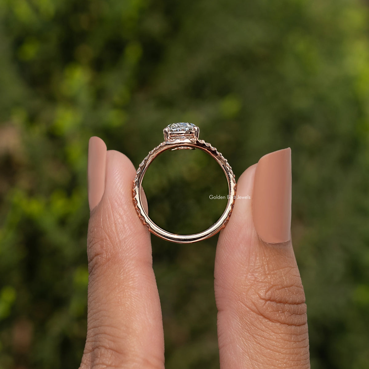 Oval lab diamond ring back view showing open shank and prong-set center stone