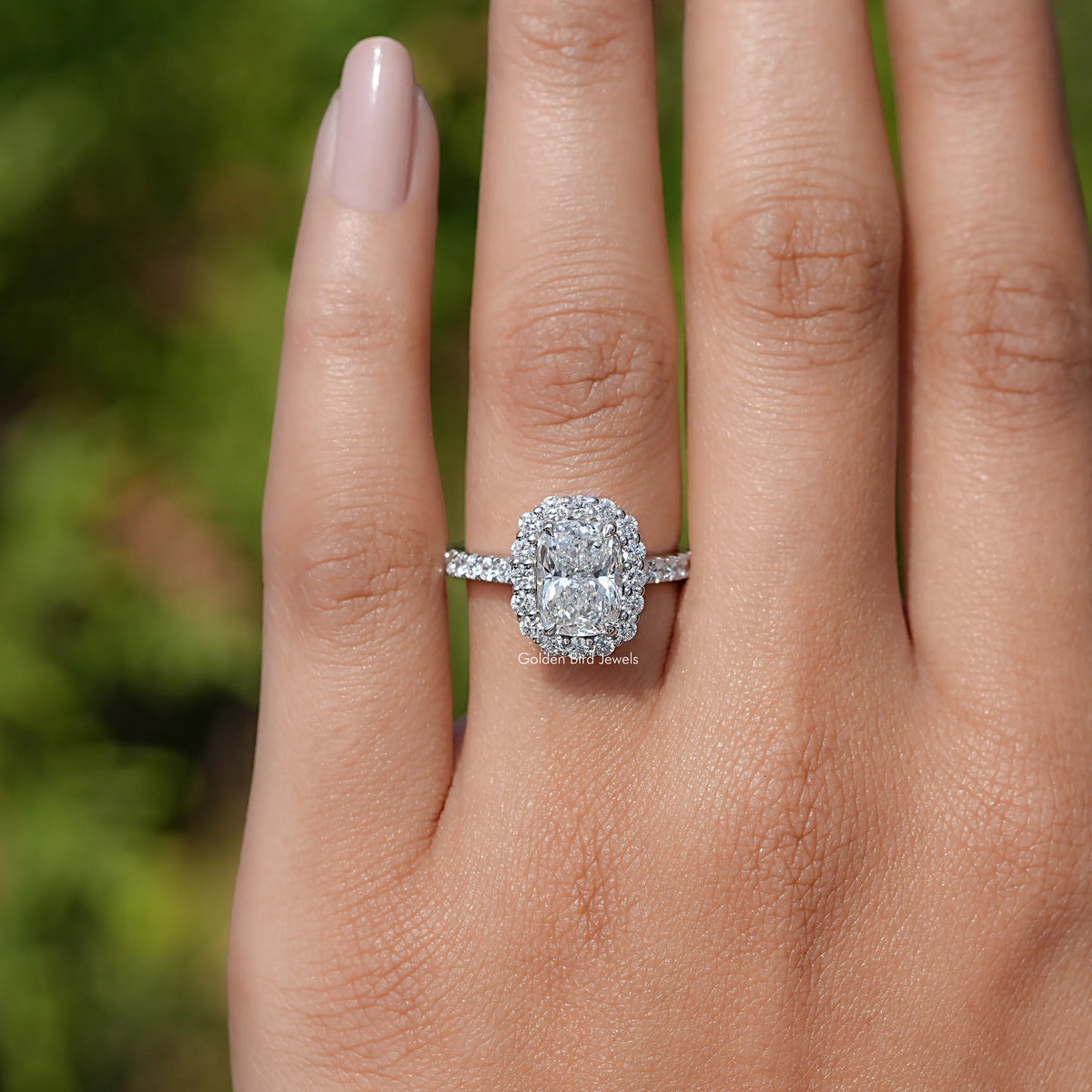 In finger front view of Cushion Lab Diamond Halo Accent Engagement Ring  