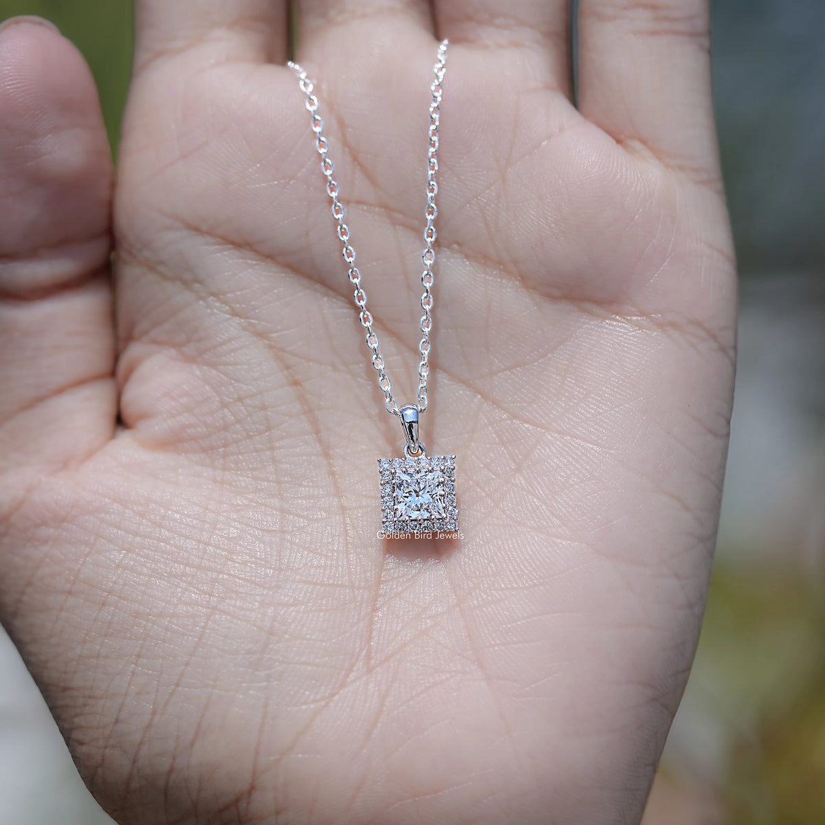 In Hand Showing of Princess Cut Lab Diamond Halo Pendant