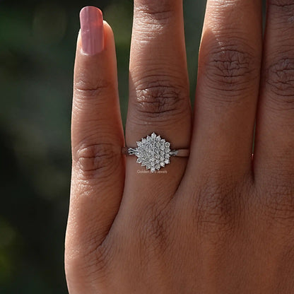 White gold ring with round lab-grown diamonds worn on finger.