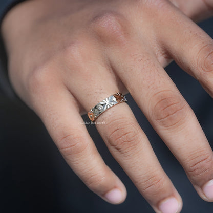 Silver men’s lab-diamond ring close-up on hand, geometric engraving and center stone
