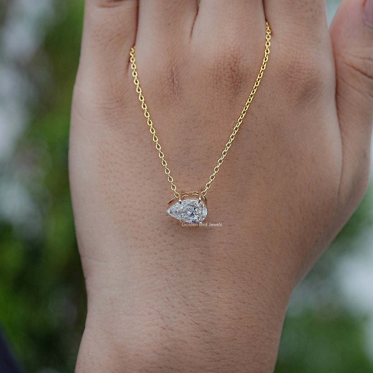 In Hand Showing of Pear Shaped Lab Diamond Necklace