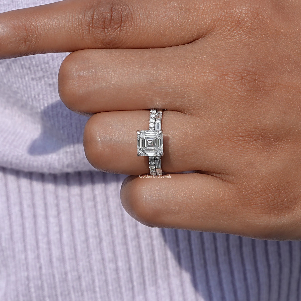 Emerald Shaped lab Diamond Wedding Ring Set on a finger, front view