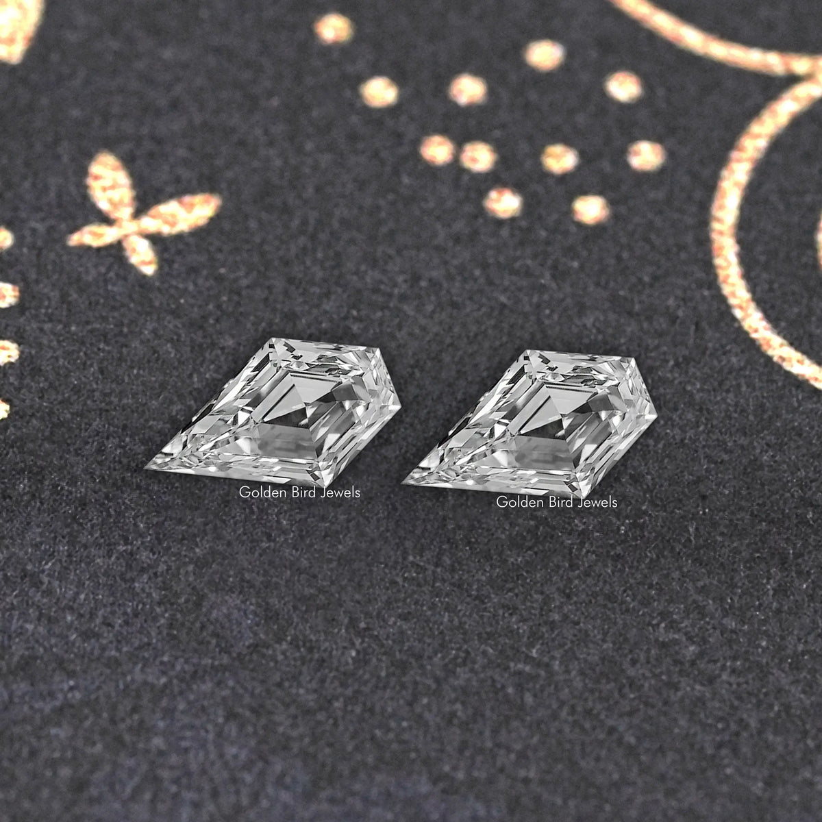 Two clear arrow-shaped lab-grown diamonds, close-up showing reflective facets