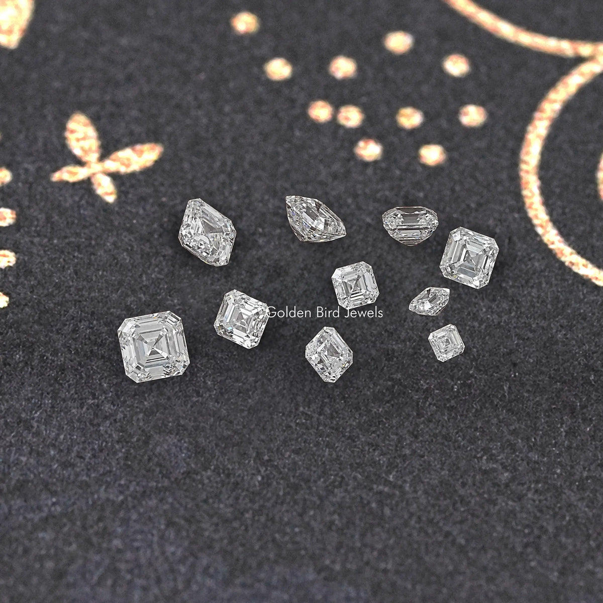 Asscher-cut lab diamonds scattered on dark jewelry display fabric, step-cut detail