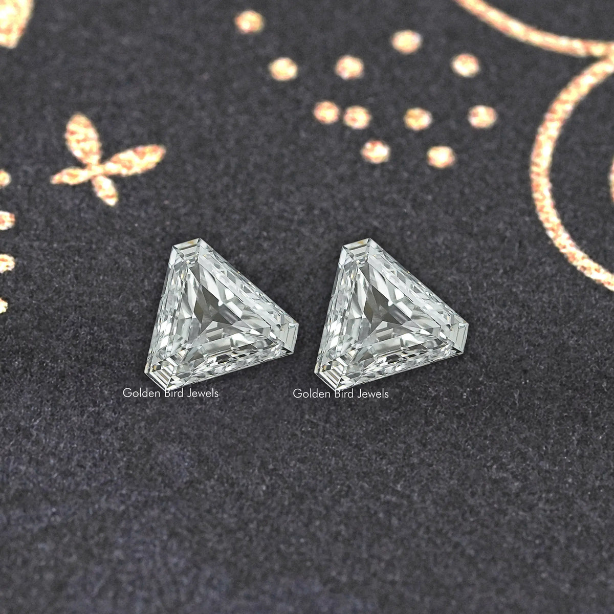 Pair of modified trillion-cut lab-grown diamonds, clear stones with faceted sparkle