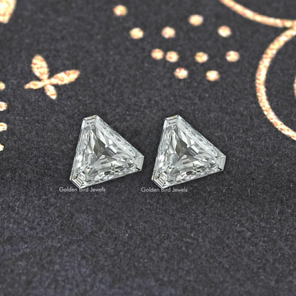 Pair of modified trillion-cut lab-grown diamonds, clear stones with faceted sparkle