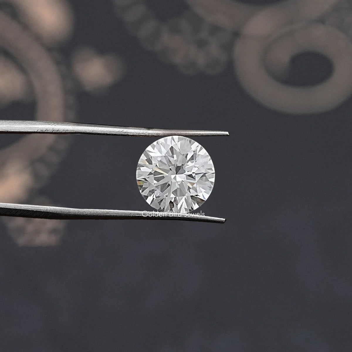 Loose round-cut lab diamond, GIA certified, held in silver tweezers