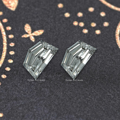 Pair of rectangular emerald-cut lab-grown diamonds, step facets, clear