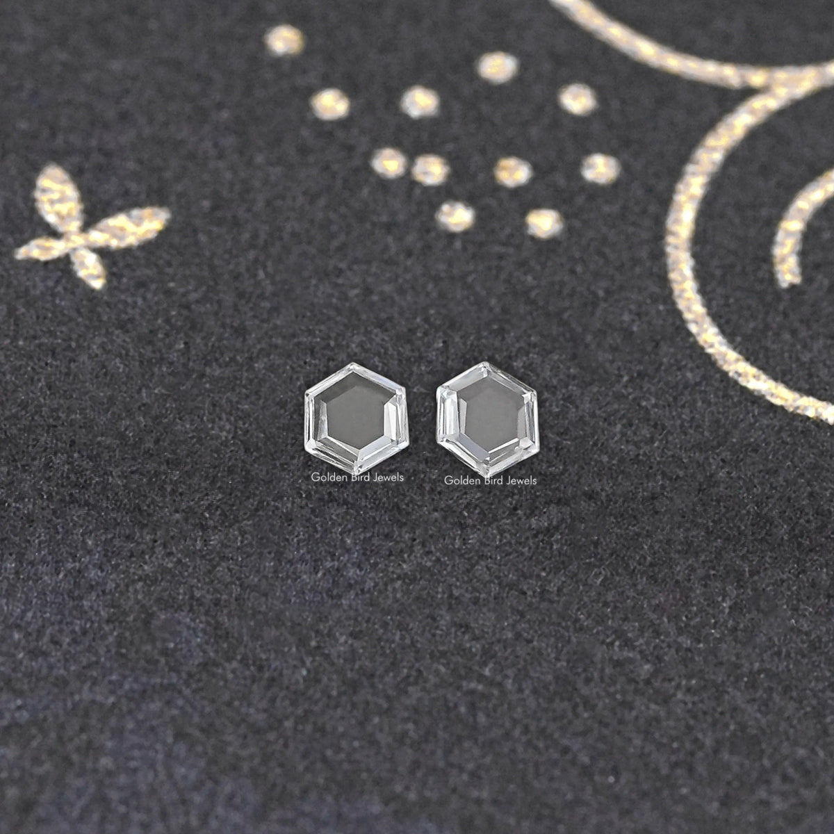 Loose hexagon lab-grown diamond pair, two clear faceted stones front view