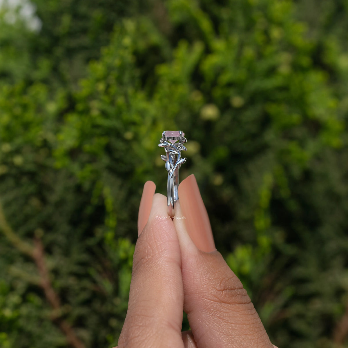 Leaf-style rose quartz solitaire ring in 925 Argentium silver, side view