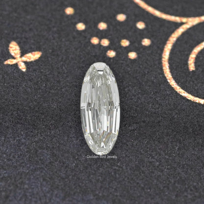 Long oval cut lab-grown diamond with symmetrical, linear facets