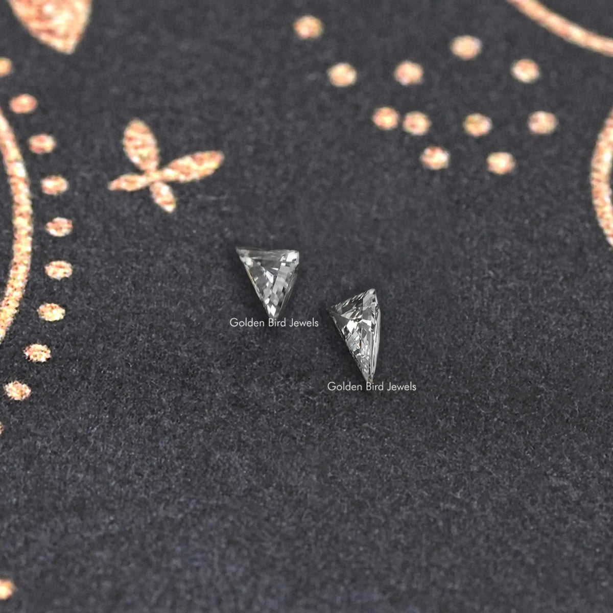 Long triangle lab-cut diamond studs, angled view, faceted triangular stones