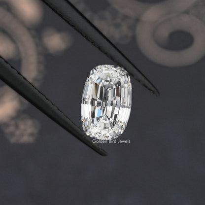 Loose cushion step-cut lab diamond, angled close-up showing detailed facets