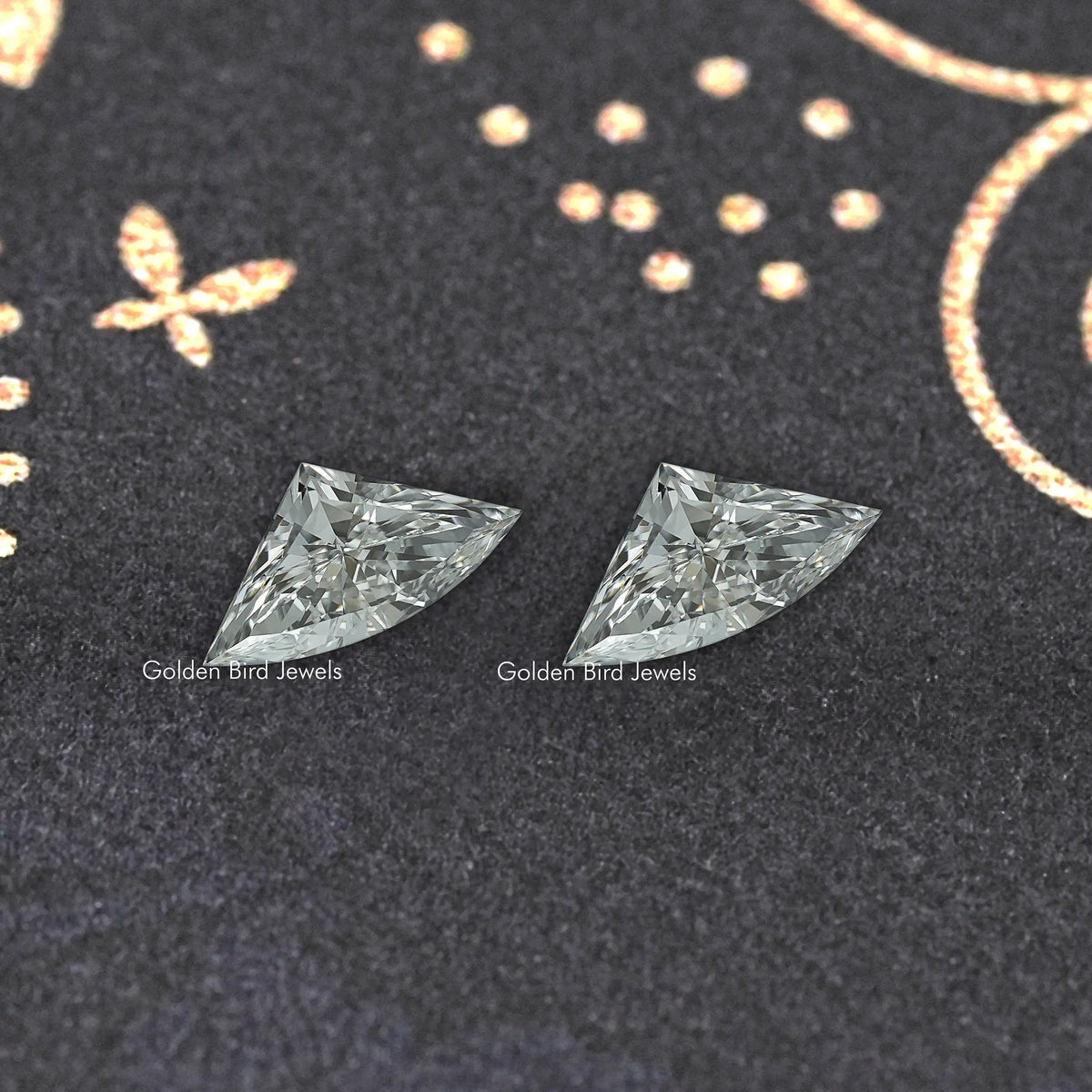 Pair of faceted marquise-shaped lab-grown diamonds, clear icy gray facets