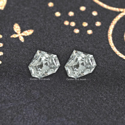Pair of octagonal step-cut lab-grown diamonds with bright facet highlights