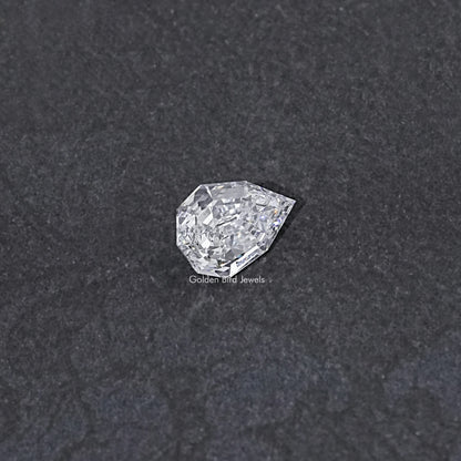 Lab-grown pear-cut diamond, step-cut faceted surface, loose stone view