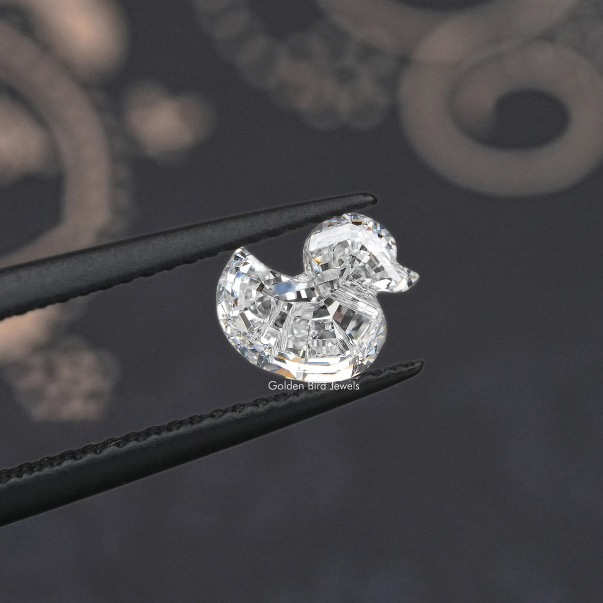 Duck-cut lab-grown diamond with rounded facets, pointed ends, side view