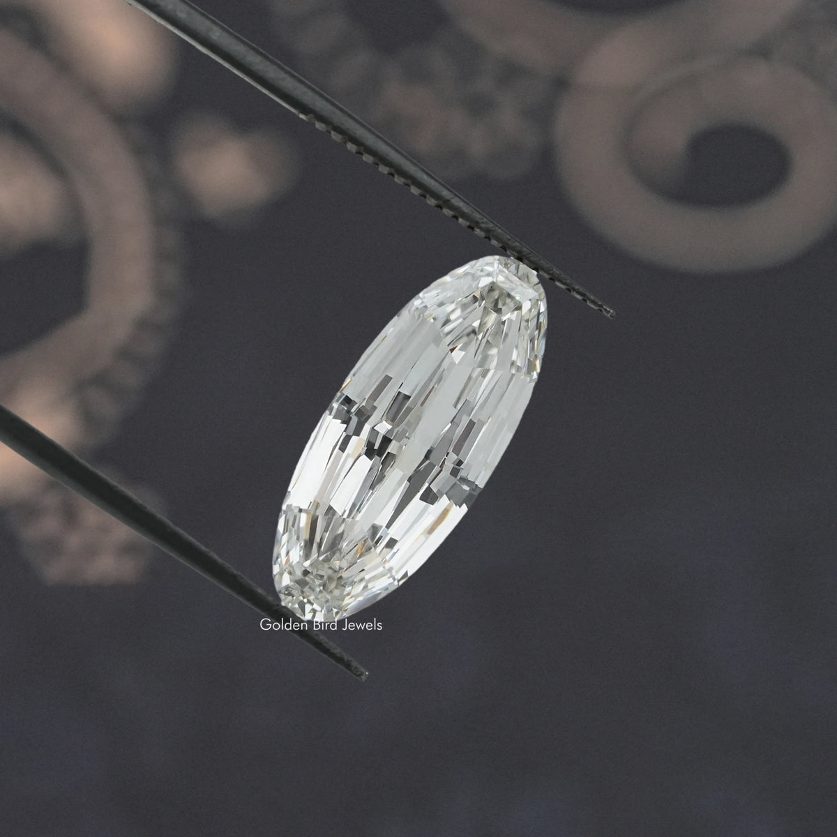 Long oval lab-grown diamond detail on a metal support
