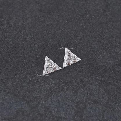 Matching triangle-cut moissanite stones, faceted angled view