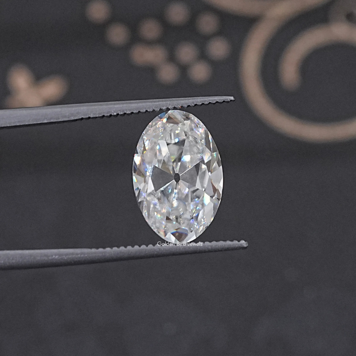 In Tweezer View Of Old Mine Oval Cut Loose Moissanite Stone