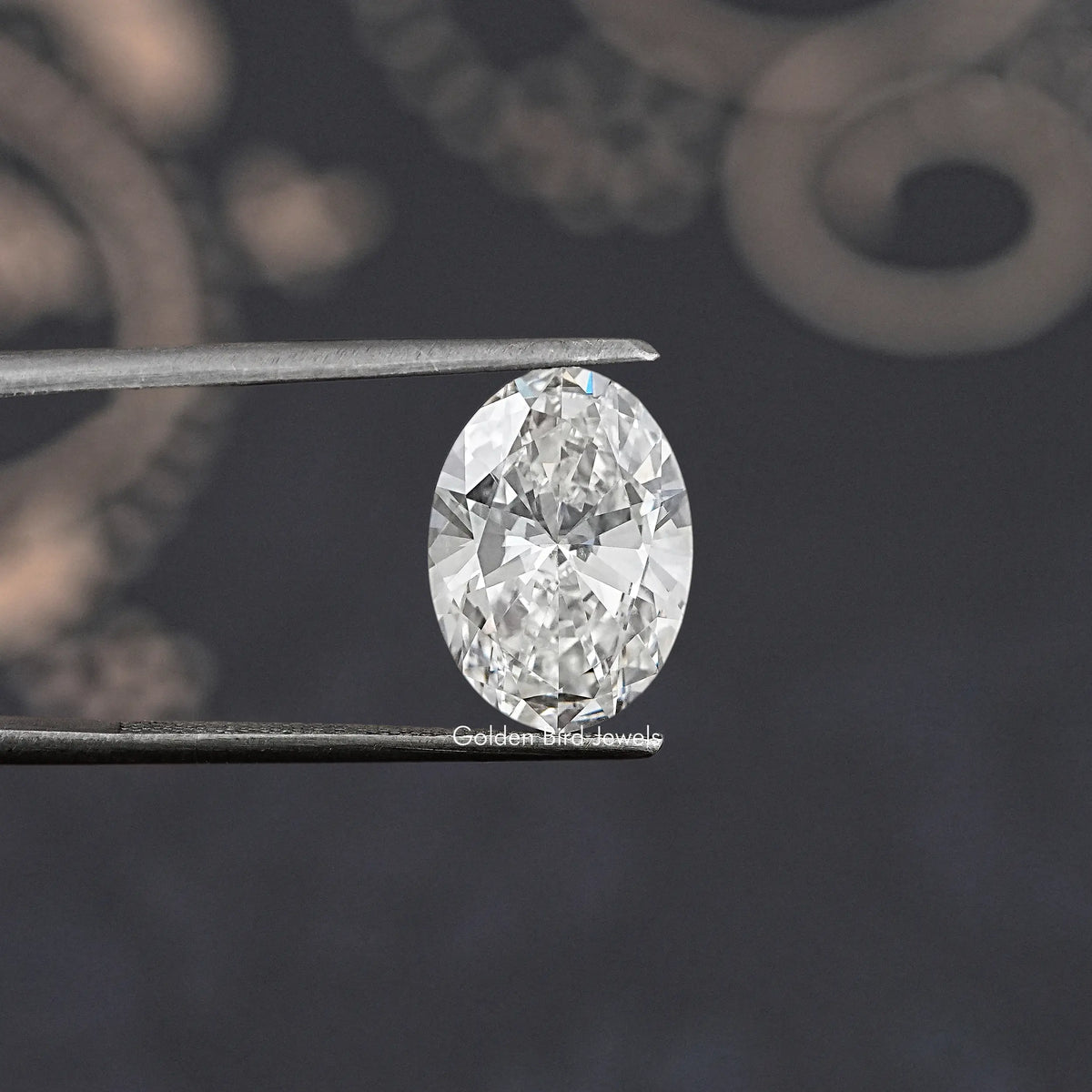 Oval lab diamond close-up on metal prongs, reflective sparkle