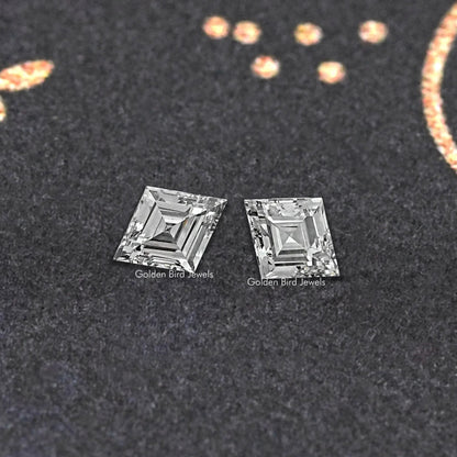 Pair of lozenge-cut lab-grown diamonds, clear stones with faceted edges.