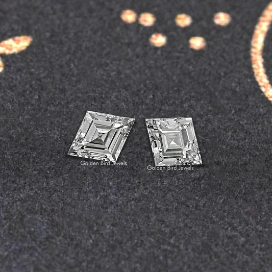 Pair of lozenge-cut lab-grown diamonds, clear stones with faceted edges.