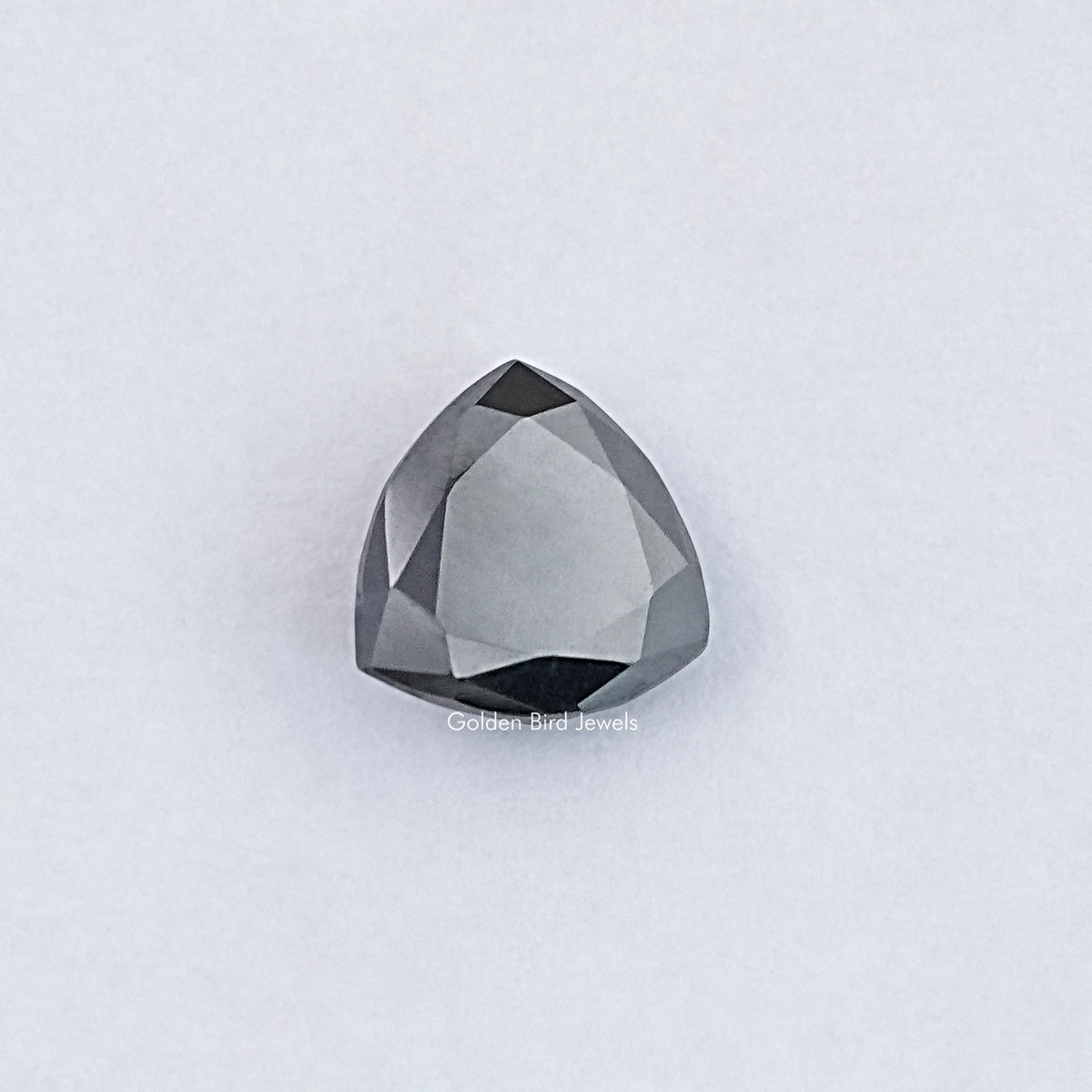 Trillion-cut clear moissanite loose stone with faceted surface