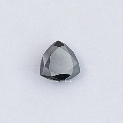 Trillion-cut clear moissanite loose stone with faceted surface