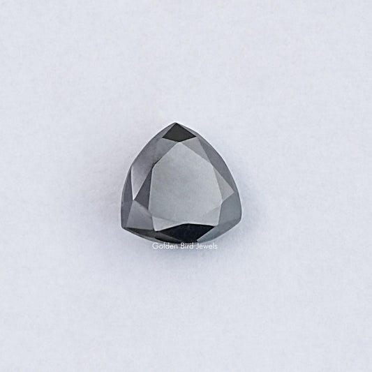 Trillion-cut clear moissanite loose stone with faceted surface
