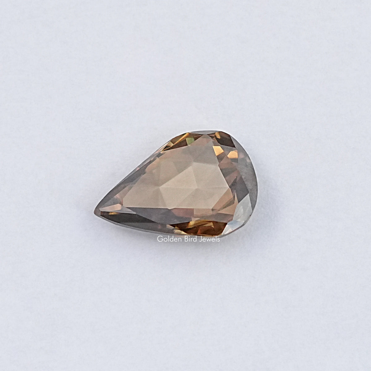 Golden brown pear-shaped rose-cut moissanite gemstone