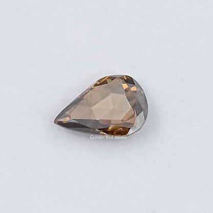 Golden brown pear-shaped rose-cut moissanite gemstone