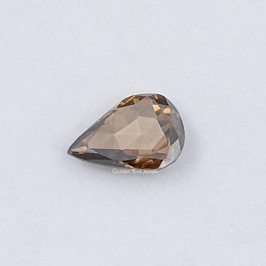 Golden brown pear-shaped rose-cut moissanite gemstone