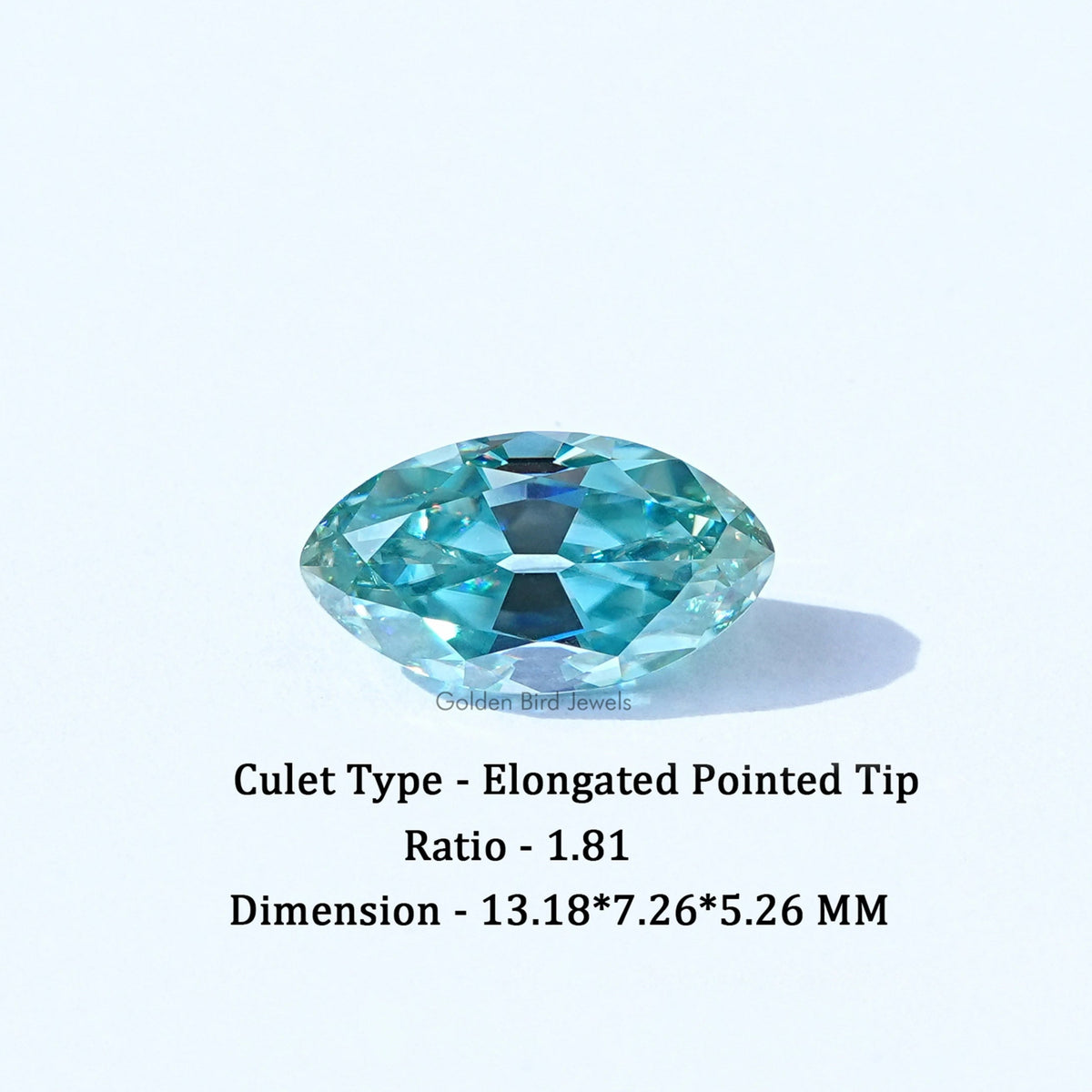 Loose cyan blue gemstone with elongated pointed tip and faceted cut