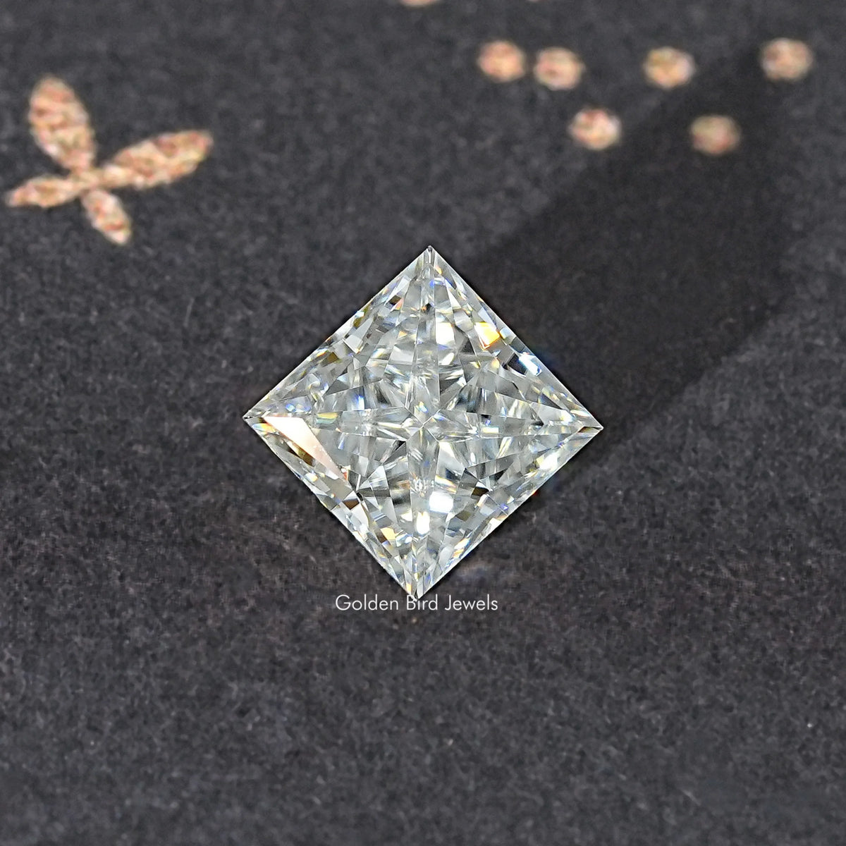 Princess-cut moissanite loose stone, close-up clear square with high-contrast facets.