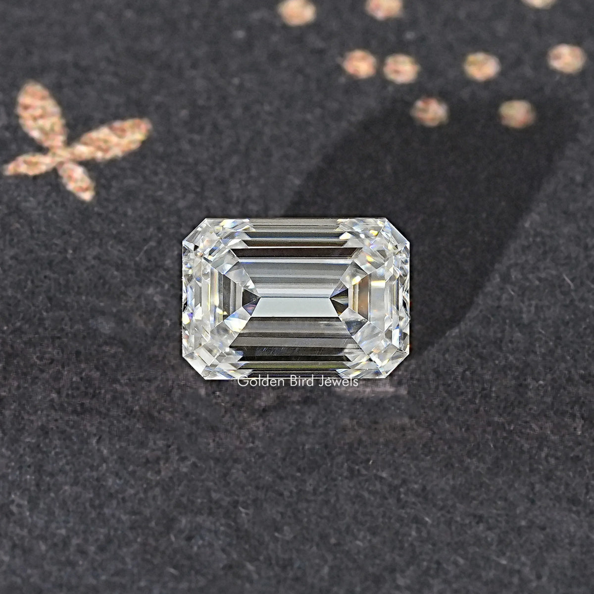 Near colorless emerald-cut moissanite loose stone, symmetrical rectangular step-cut