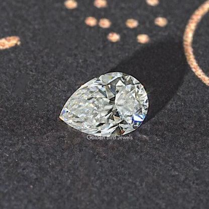 Pear-cut colorless moissanite loose stone with bright facet highlights.