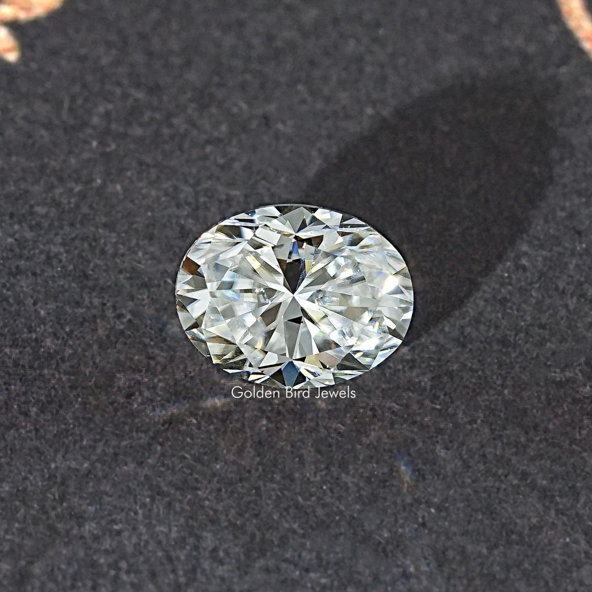 Oval moissanite loose stone, face-up view with strong sparkle and symmetry