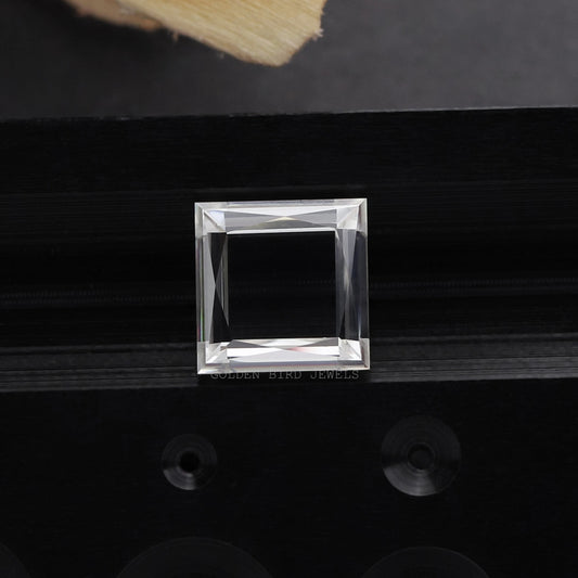 Square princess-cut moissanite gemstone in clear setting