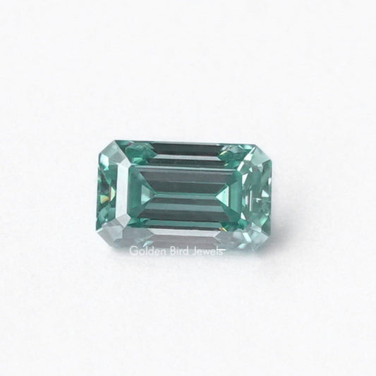 Emerald-cut dark green moissanite loose stone with faceted sides