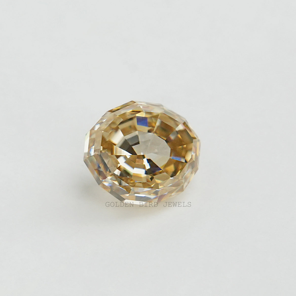 Loose oval step-cut moissanite gemstone, golden yellow with faceted facets