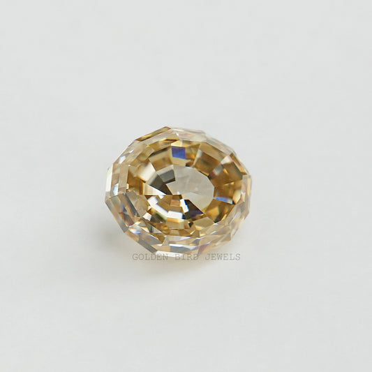 Loose oval step-cut moissanite gemstone, golden yellow with faceted facets