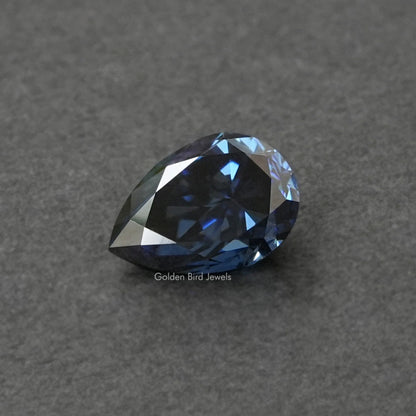 Loose pear-cut blue moissanite gemstone, faceted teardrop shape