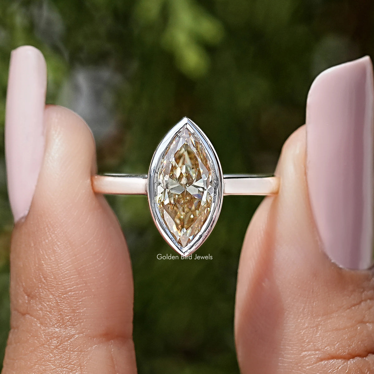 Marquise bezel engagement ring in silver with yellow marquise-cut center stone