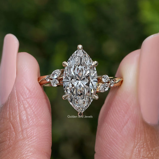 Marquise-cut center stone ring with halo and small round side stones