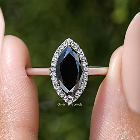 Sterling silver marquise halo ring with dark center gemstone
