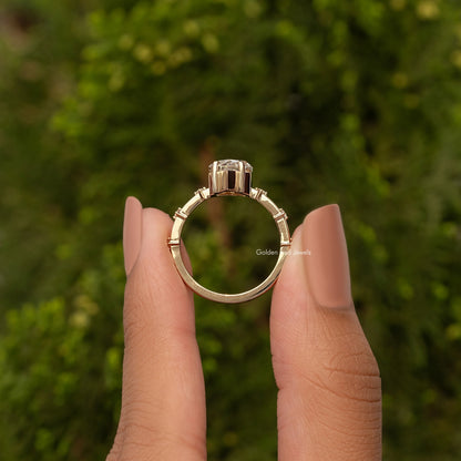 Gold-tone marquise moissanite ring back view with bezel-like center setting