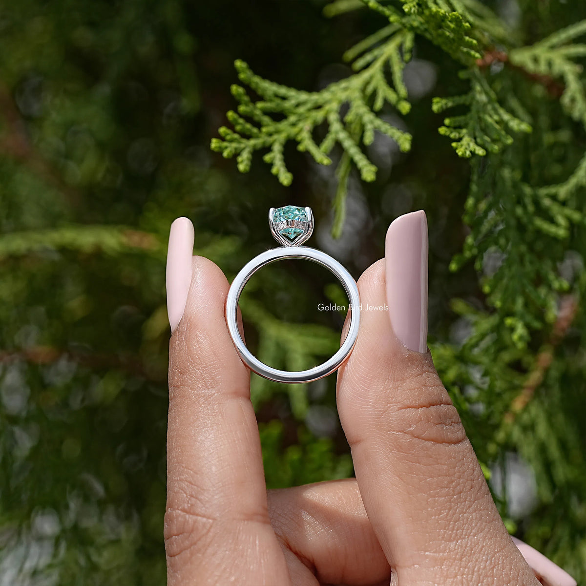 Sterling silver marquise moissanite ring with hidden halo, light blue center stone